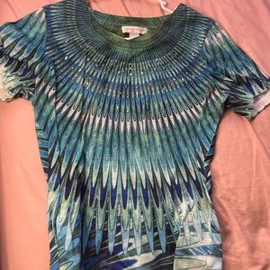 Very comfy shirt and adorable. Soft fabric material and has sequins on the shirt